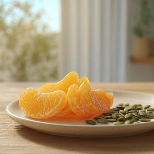 orange slices and pumpkin seeds